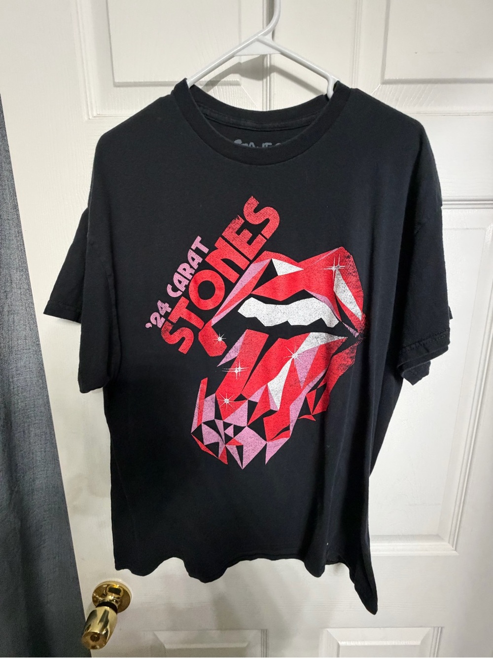 the Rolling Stones Black Tee with Red and Pink Faceted Tongue Graphic